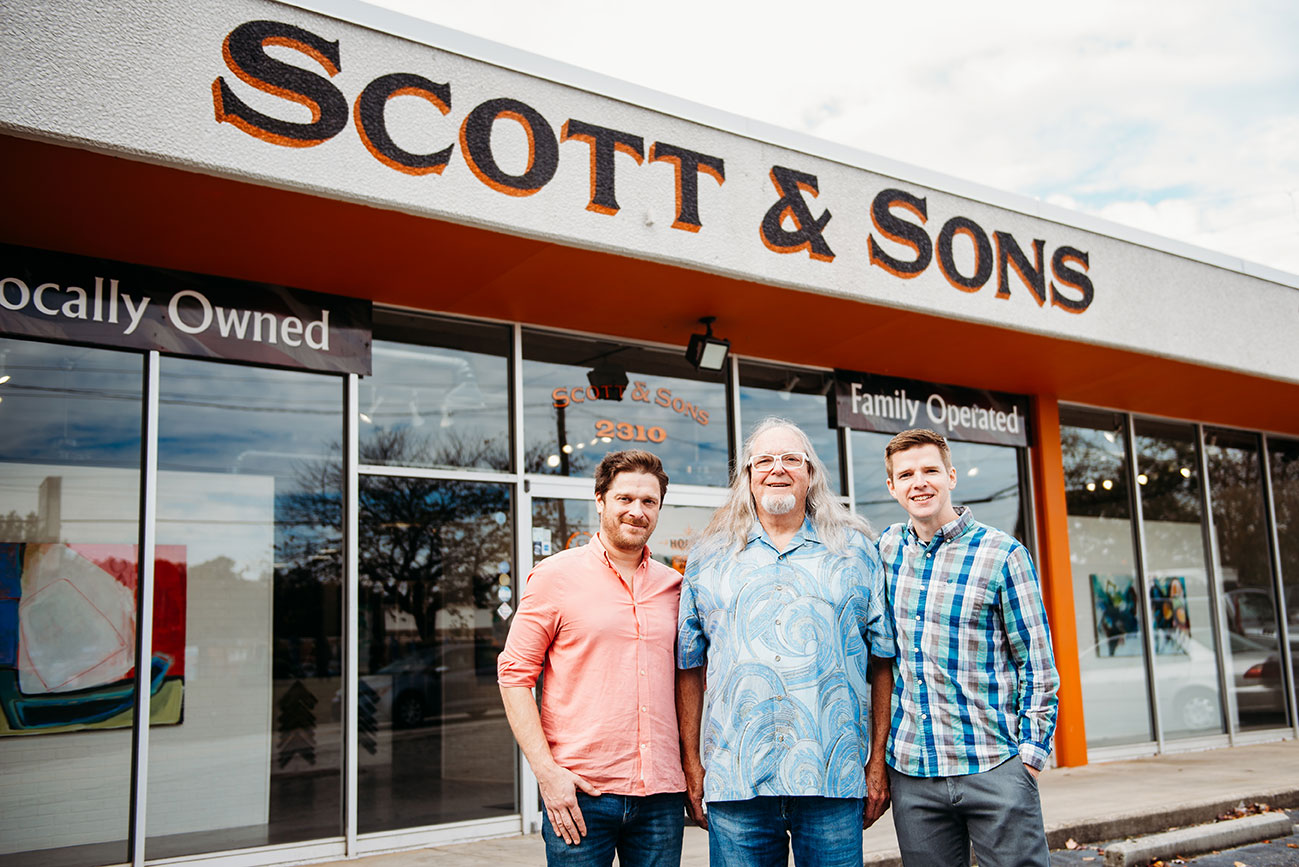 Three generations of a family standing in front of their Atlanta location.