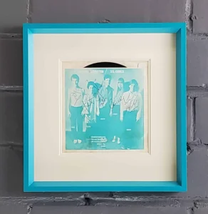 B-52's, A picture of the beatles in a blue frame.