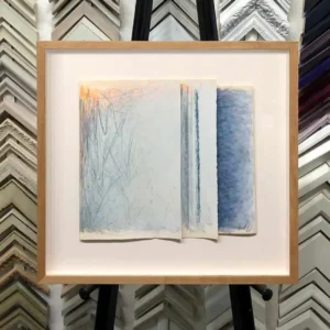 A picture frame with some papers on it