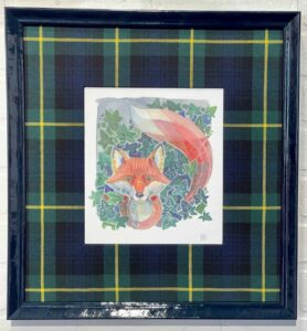A painting of a fox and fish in a frame.