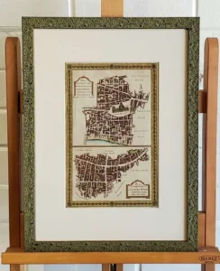 A framed map of the city of baltimore.