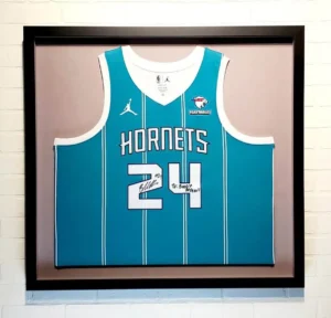 A framed jersey of the hornets is displayed.