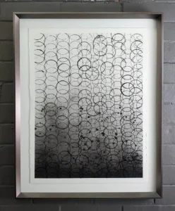 A picture of a wall with many circles on it.