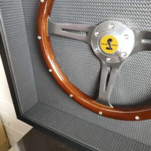 A steering wheel with the number 1 3 on it.