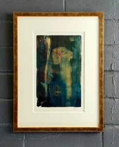 A framed photograph of a woman in the water.