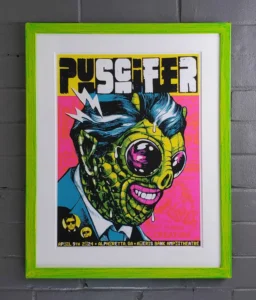 A framed poster of a man with a face like a zombie.
