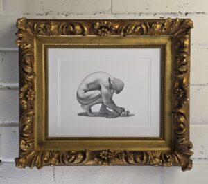 drawing of a man crouched, head down. his hands are resting upwards one atop the other. he is lit from above on a white background. The pencil work is distinct crosshatching nearly mechanical in nature. This is framed in an antique overcarved gold frame.