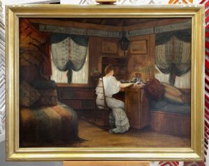 antique painting of woman from three quarters back view writing at a desk in a dark room. Windows have dark sheers, day beds have rich colored linens. Framed in a 22k gold closed corner frame with minor corner detail.
