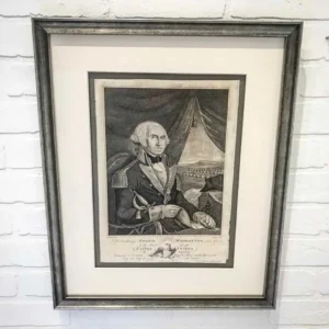 A framed picture of a man in military garb.