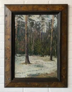 A painting of trees in the snow with a brick wall behind it.