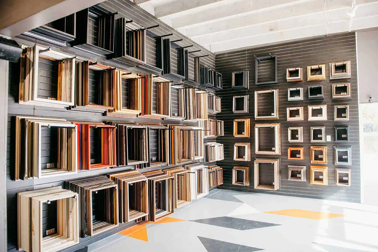 DSC_1946 A room filled with lots of shelves full of frames.