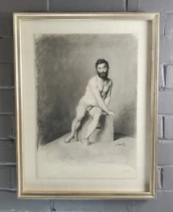 A man with a beard is sitting on the ground