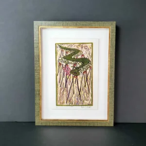 A framed picture of a plant with green leaves.