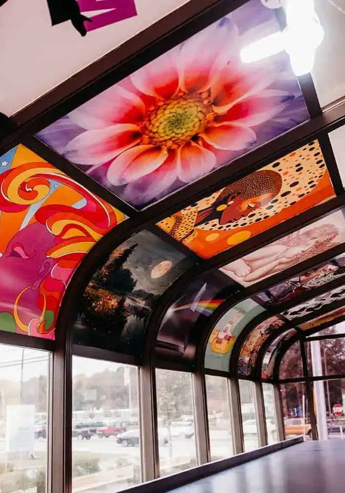 DSC_2119 (2) A bus stop with many different pictures on the ceiling.