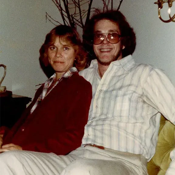 SSweb005 (1) A man and woman sitting on the couch together.